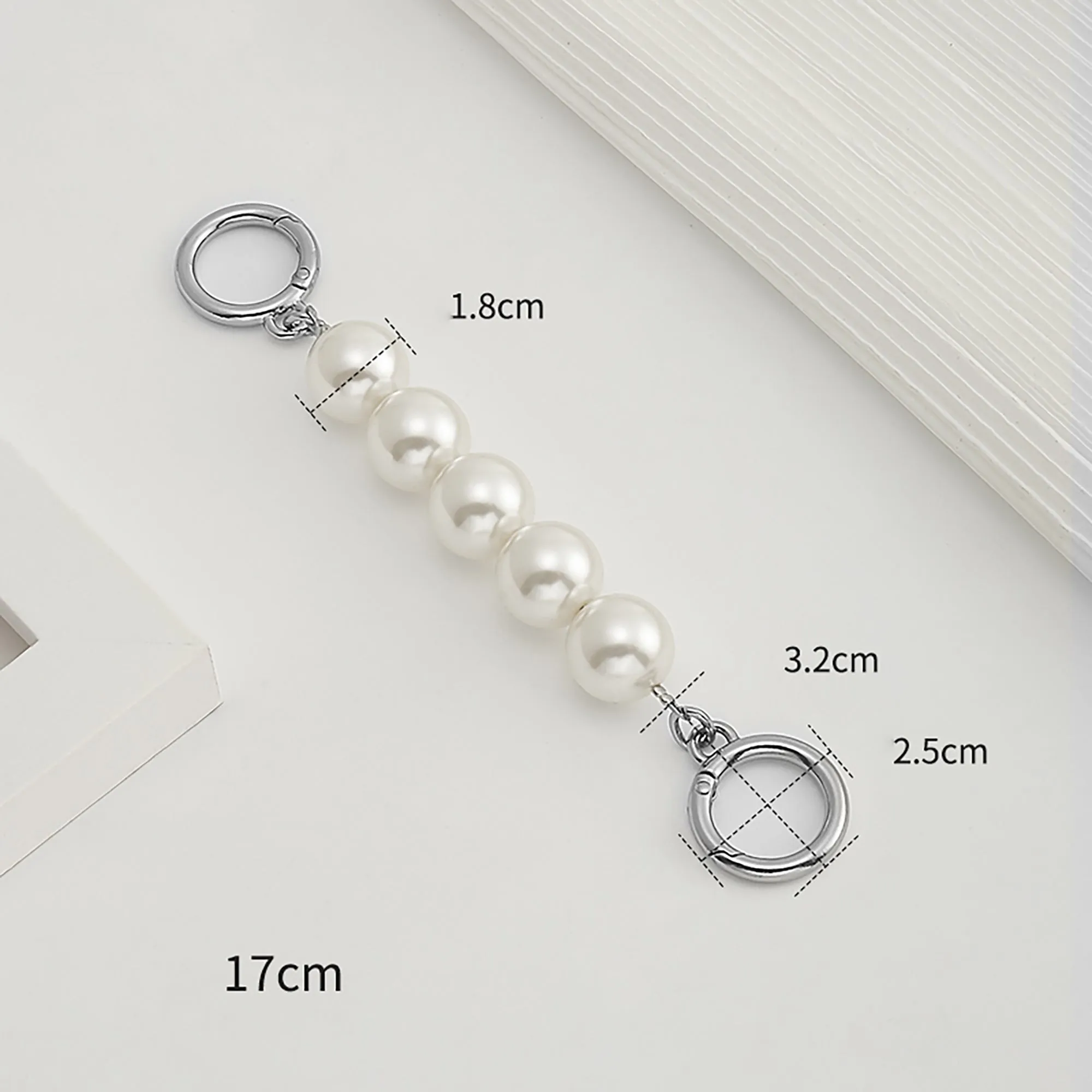 Underarm bag strap extension accessory, pearl extension chain, metal chain strap modification for bags.