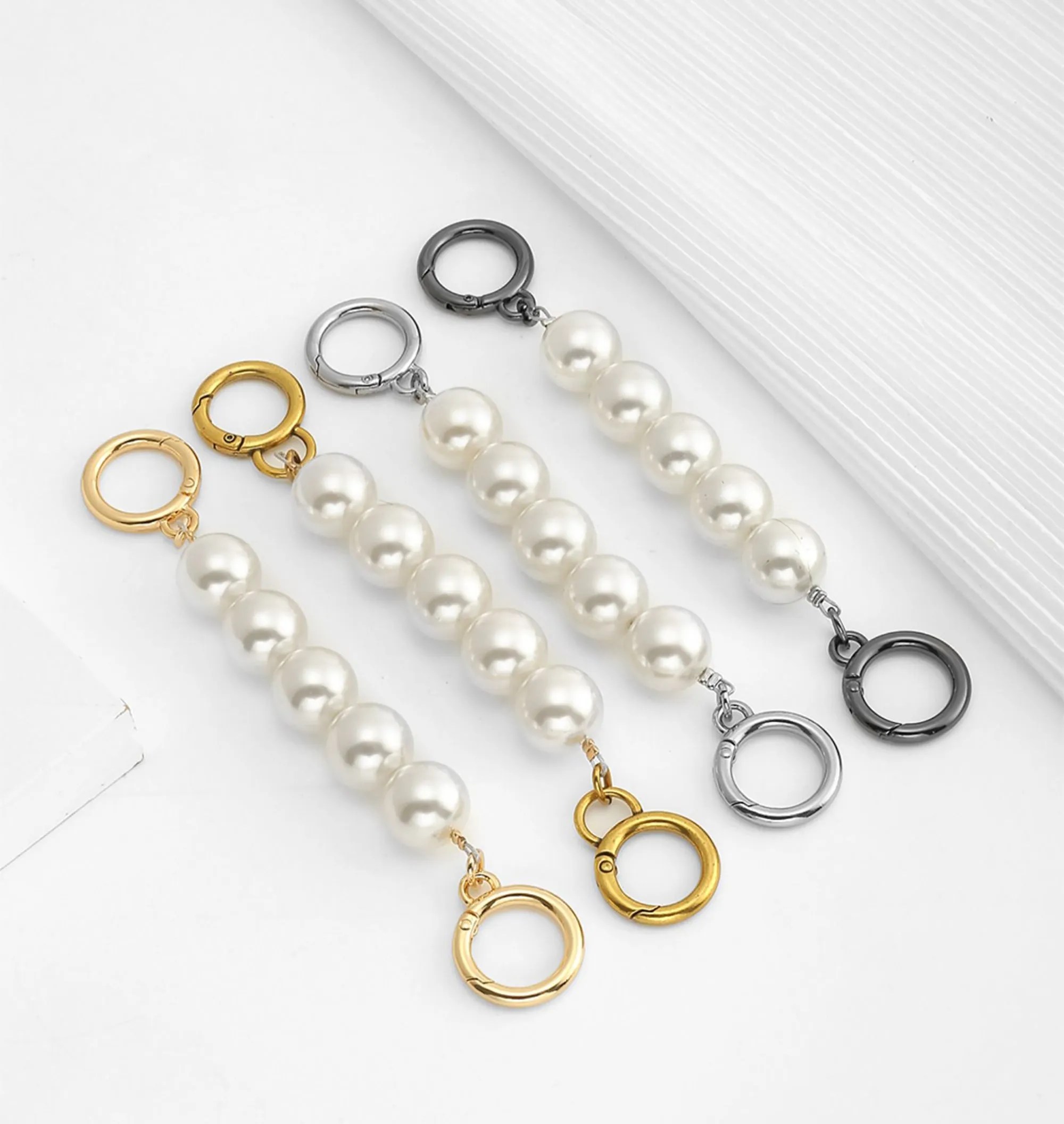 Underarm bag strap extension accessory, pearl extension chain, metal chain strap modification for bags.