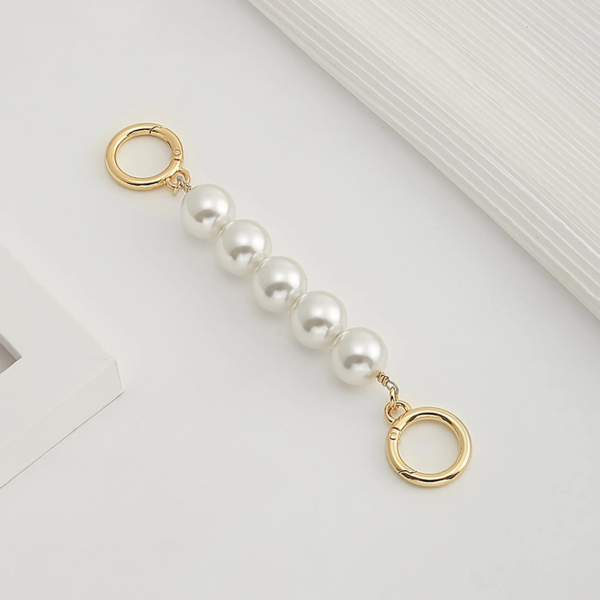 Underarm bag strap extension accessory, pearl extension chain, metal chain strap modification for bags.