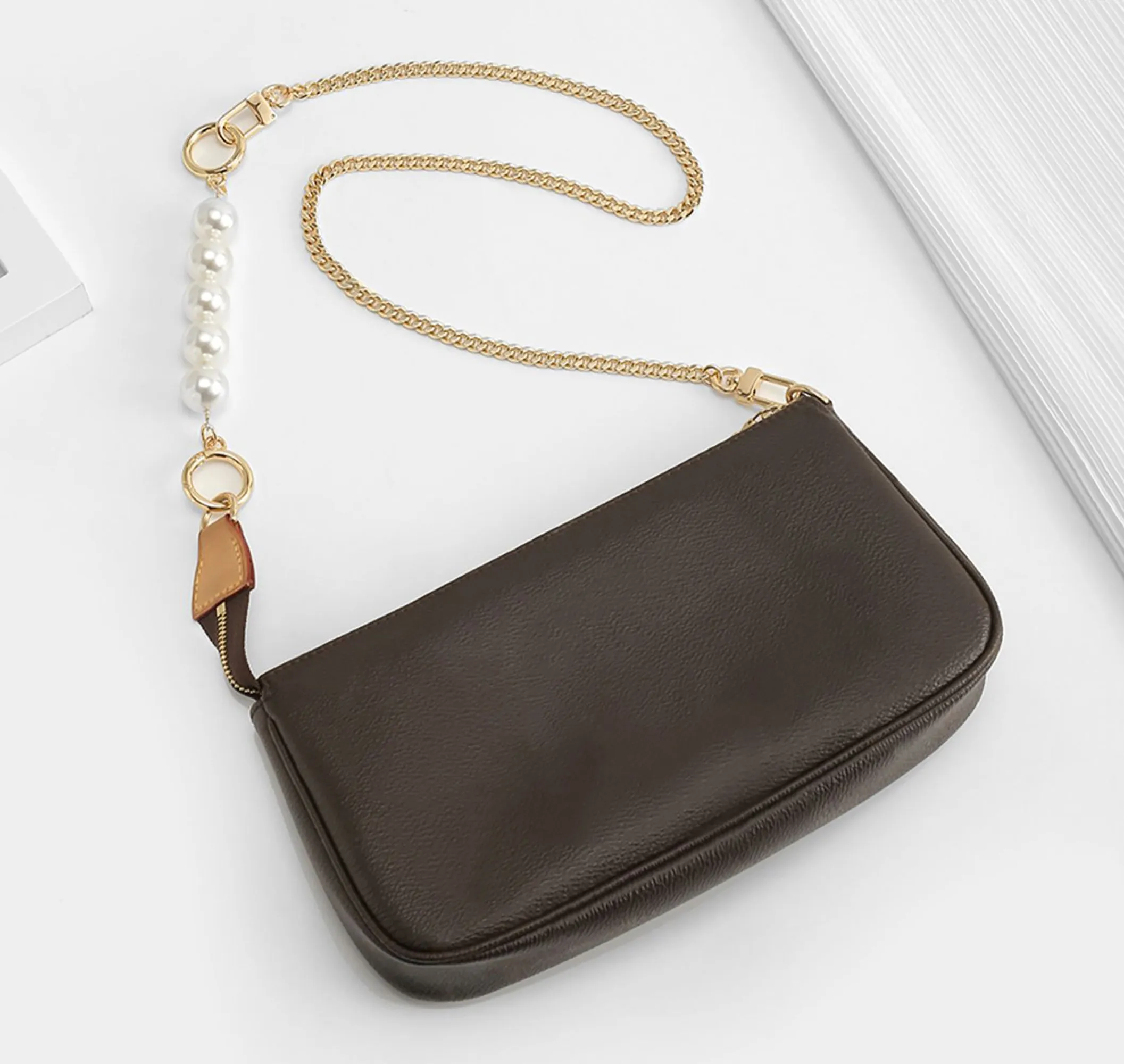 Underarm bag strap extension accessory, pearl extension chain, metal chain strap modification for bags.
