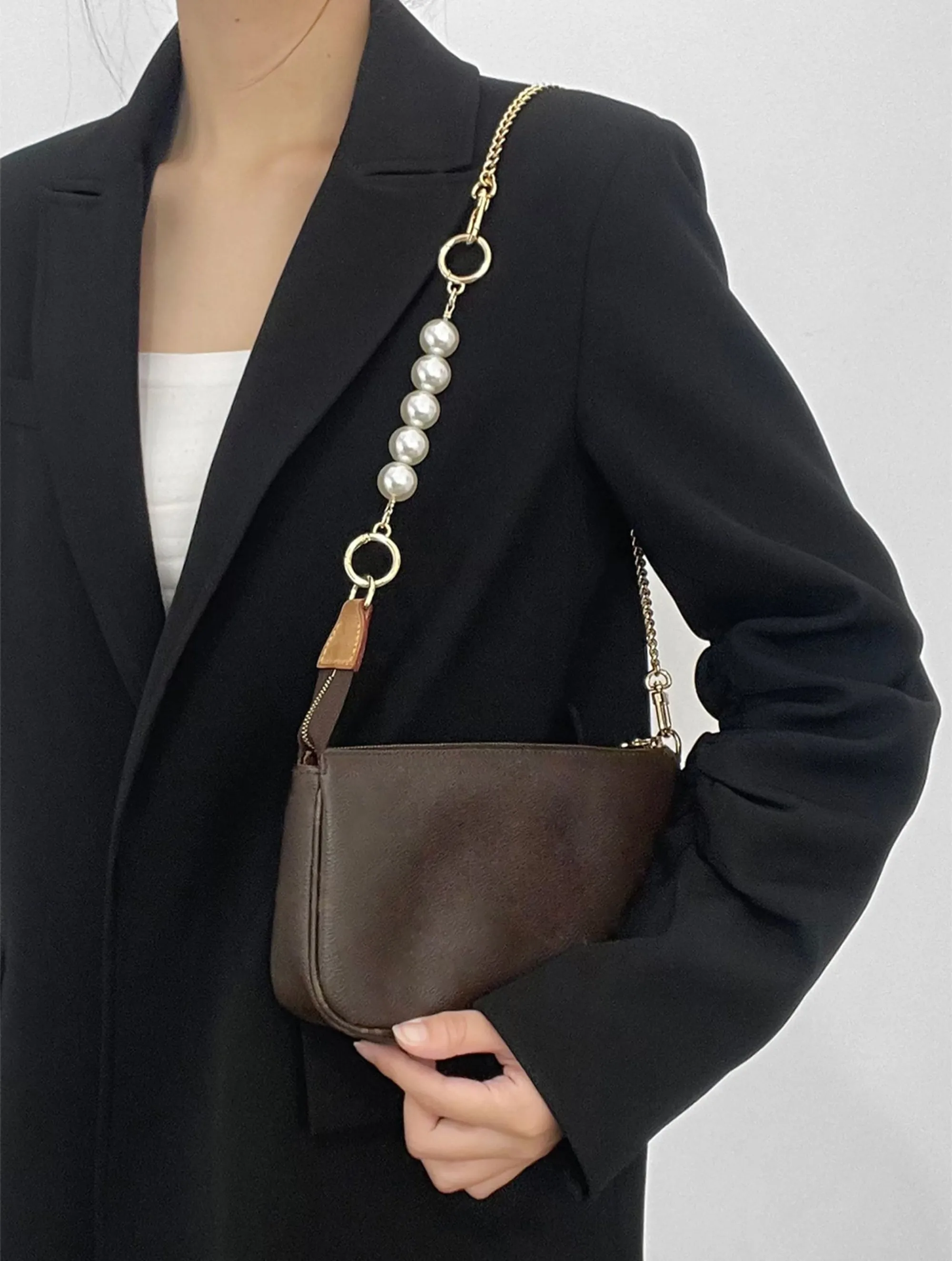 Underarm bag strap extension accessory, pearl extension chain, metal chain strap modification for bags.