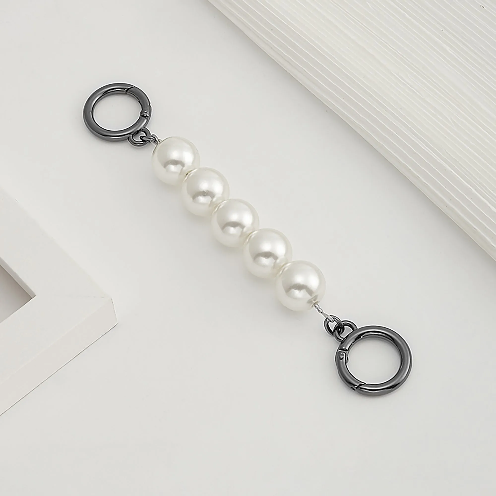 Underarm bag strap extension accessory, pearl extension chain, metal chain strap modification for bags.